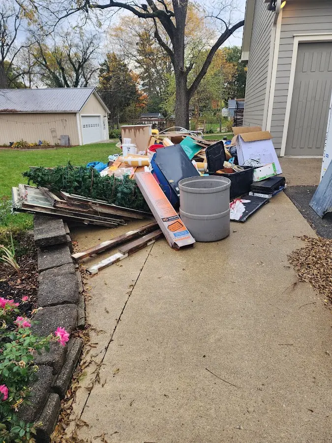 Dumpster being loaded with debris for Estate Cleanout Dumpster Rental in Loudoun Valley Estates